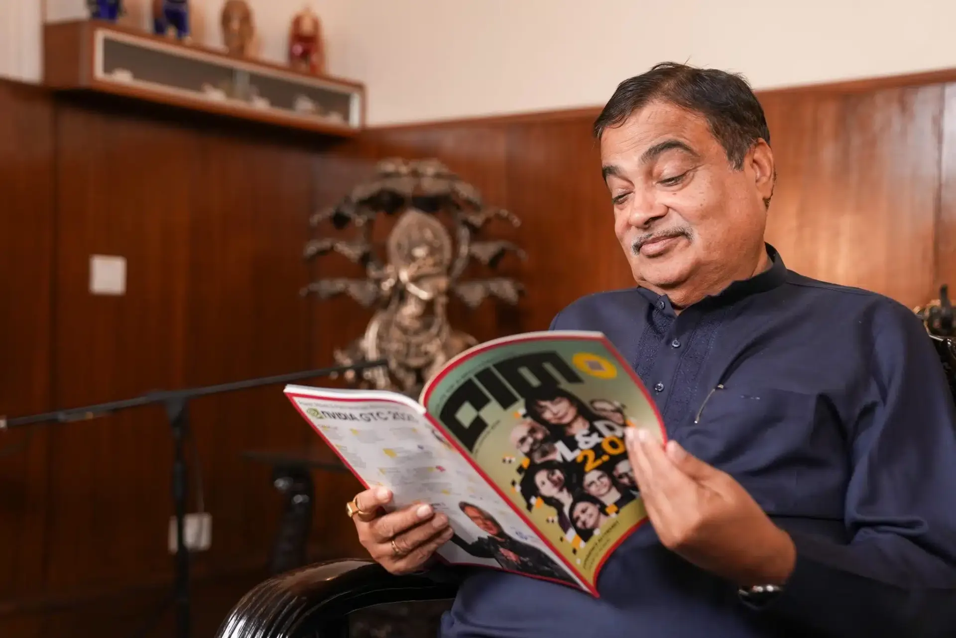 Reader with AIM Print magazine